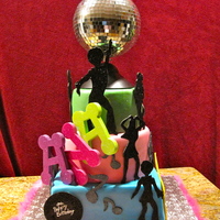 Disco Cake I made this cake for a little girl as a request for her 9th birthday. The disco ball spins on top of the 8" tier. I didn't want...