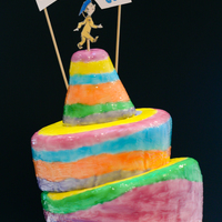 Oh! The Places You'll Go! Graduation Cake MMF, stripes painted on with tinted piping gel. It looked cool, but took several coats. I think next time I'd just paint it with...