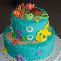 Finding Nemo Cake My first tiered cake! The bottom tier is chocolate and the top is "yellow". The cake is covered in buttercream frosting and the...