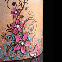 Cocoa Butter Painting. Colored cocoa butter layering and texture. Airbrush base and splatter. Hand painted vines and flowers. Flowers are edible printer paper...