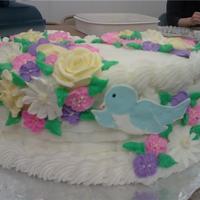 Flower Cake Buttercream flowers and color flow bird.
