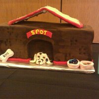 Puppy In The Dog House 4 layer white cake with buttercream. Fondant with gumpaste figures. Sugar cookie roof.