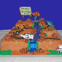 Dirt Track Truck Cake This was a cake for my 13 year old grandson Eric. He is one of twins and he likes truck races. The bottom layer is a 11x15 cake pan. The...