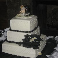 Black Ropes And Bows! 3 tier, square cake, buttercream icing, fondant rope and callas and bow.