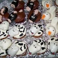 Farm Animal Cupcakes 3 of 6 different kinds of farm animal cupcakes created for a child's birthday party. These are the horses, cows, and ducks.