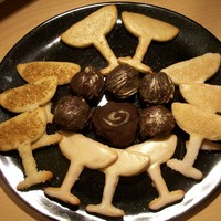New Years Cookies And Chocolate Truffles New Years 2010 - these are butter cookies and gold-dusted chocolate-Pama (pomegranate liqueur) truffles. The one with the gold swirl on it...