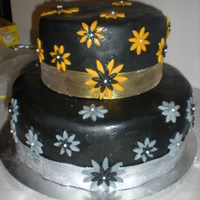 50Th Birthday Guava cake with cream cheese frosting and black fondant..Florida heat and humidity is showing...1st 2 tier cake