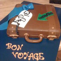 Bon Voyage a going away cake made for a boss who was relocating. white cake with strawberry buttercream. handpainted gold accents. all fonant and...