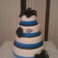 Something Blue royal blue and black wedding cake. handmade black anemonies. my first gumpaste flowers ever!!! took forever to make but i think they turned...