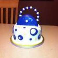 Purse Cake I did this cake for a friend. It was purple and gold, however looks blue in the picture. All vanilla with vanilla buttercream. It was a lot...