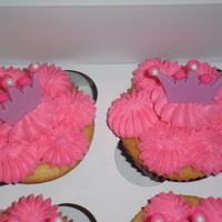 Princess Cupcakes Vanilla cupcake w/ Rasberry buttercream topped with fondant tiara.