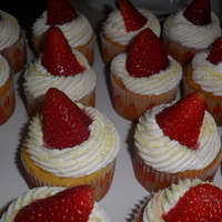 Strawberry Lemonade In A Cupcake! Lemon Cupcake filled with Fresh Strawberry filling, topped with Lemon Buttercream and a strawberry! These were so refreshing on a hot...