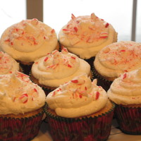 Candy-Cane Cupcakes! A vanilla sponge cake with crushed candycanes folded into the batter. Vanilla-bean buttercream, with more crushed candy