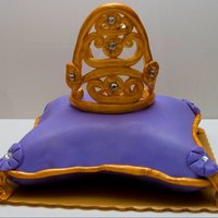 Pillow Cake With Crown Crown made out of 50 /50 gumpaste and fondant. Coconut cake with cream cheese filling. Cake that i made for my mom!