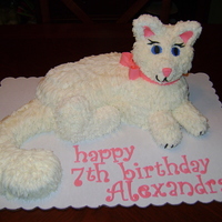 3D Kitty Cat Cake Head and feet are made of RKT, body and tail are cake. Covered in buttercream icing with fondant accents.