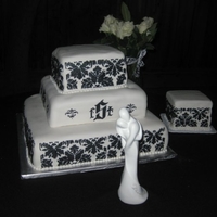 Damask Stencil Square Wedding Cake My FIRST wedding, tier, & stenciling cake!Three tiers: 8in, 12in, 16in. Side 6in square cake. Covered in buttercream fondant with black...
