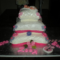 Baby Shower Top layer and bottom layer is white cake with pineaple coconut cream filling and the middle pillow is chocolate with chocolate butter cream...