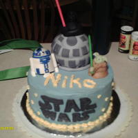 Star Wars Birthday Birthday cake with a Star Wars theme. Buttercream covered cake, mmf figures. The "death star" is a small round cake covered in...