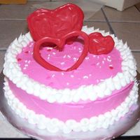 Valentine's Cake For Mom This is a cake I made my mom for Valentine's Day. It's a white cake with cookies & cream filling & the icing is BC. The...