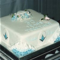 Pearl Wedding/masonic Celebration Cake Fruit cake covered with marzipan and sugarpaste. The sides are decorated with mini plaques with hand painted Masonic square and compass...