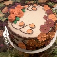 Wilton 2Nd Course Final This is a red velvet cake with buttercream icing and royal icing roses and apple blossoms.