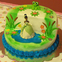 Tiana Tiana theme cake with Tiana doll on top.