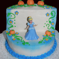 Cinderella Cake This was a Cinderella themed cake. Buttercream and fondant flowers and pumpkins. Cinderella doll provided by birthday party guest.
