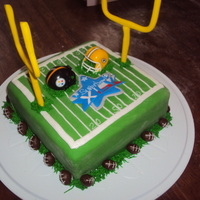 Superbowl Xlv Superbowl XLV cake. Cake, field goal posts, cake, emblem in middle of field and footballs around bottom are all fondant. Grass on bottom is...