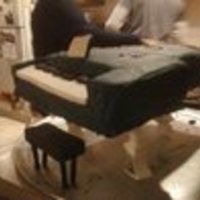 Piano Cake Piano cake. First time trying to make a 3D cake for my brother. Wanted to cover it in fondant but funds and time were running low. My leg...