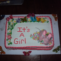 Butterfly Garden My first baby shower cake. First time making fondant booties and butterflies. I think it came out cute!!