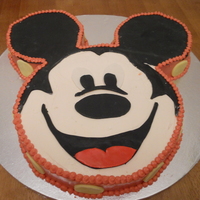 Mickey Mouse A mixture of fondant and buttercream were used to make this Mickey face.