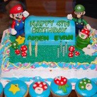 Mario And Luigi Cake I decorated a plain ice cream cake I bought from the store. I made everything except for mario and luigi (they are pvc :D)... everythign...