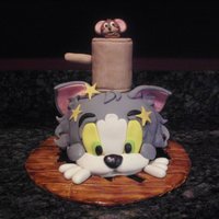 ~Tom And Jerry~ Jerry is knocking Tom through the floor! Tom is seeing stars!!! I made everything by hand! Tom is all cake! :) (I got the idea from Debbie...