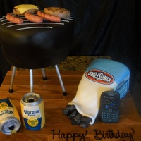 Bbq Grillin & Beers Cake Prepared as customer requested. Used chocolate cake, rice cereal, marshmallows, and edible images to complete design.