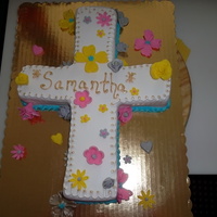 Cross First Communion This is a butter yellow cake, topped with fondant and flowers made from gumpaste as accents, the borders and name are piped with royal...
