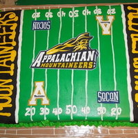 Appalachian State This is a full sheet cake topped with buttercream, a printed sugar sheet and a few fondant accents!