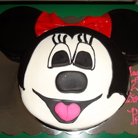 Minnie Mouse An 8 inch round is topped with 2 6 inch rounds and covered with buttercream and fondant accents, the bow is red gumpaste.....
