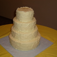 4 Tiers Textured This was a last minute order, but we were glad to make it! Its a buttercream topped cake in butter yellow color with a textured/whipped...