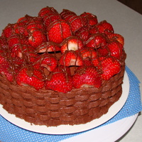 Housewarming Cake White strawberry poke cake, with strawberries and cool whip between the layers, and chocolate buttercream icing.