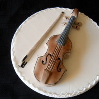 Violin Cake Topper This is free hand molded from icing. I couldn't find a mold for a violin so I copied a picture from a book.