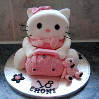 18Th Kitty Cake Kitty cake with handbag and teddy bear. The Kitty and handbag are all cake the bear is icing.