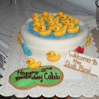 Duck Pond Duck Pond themed cake for a 2 year old party. Yellow cake with regular fondant. Ducks are casted chocolate.