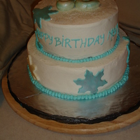 Snowflake Cake Vanilla Nut cake with raspberry filling and white chocolate frosting.