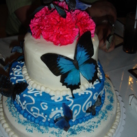 Butterfly Cake Vanilla cake with vanilla buttercream. The butterflies are edible rice paper.