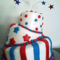 Red, White, And Blue A whimsical topsy-turvy cake. This was my first topsy-turvy cake and my first cake using fondant.