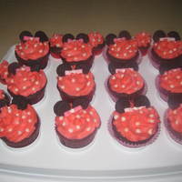 Minnie Mouse Chocolate Mocha cupcakes with buttercream frosting fondont bowties mini oreos for ears. I just had to add the dots to make it more Minnie...