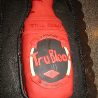 Tru Blood Cake bottle is cake covered with fondant. My first time covering with fondant. Bottle turned out a little crooked somehow? Black chocolate...
