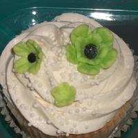 Stephanie:s Sweets Wedding Cupcake Tree. Cupcakes have vanilla buttercream. Handmade lime green and black flowers with pearl dust and non pariels. The cupcake...