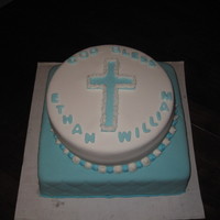 Christening Cake 12 inch square cake filled and covered with fondant and a 10 inch round filled cake.