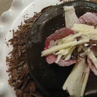 Gluten Free Indulgence! Gluten free cake covered in chocolate ganache, chocolate shavings and sugared rose petals